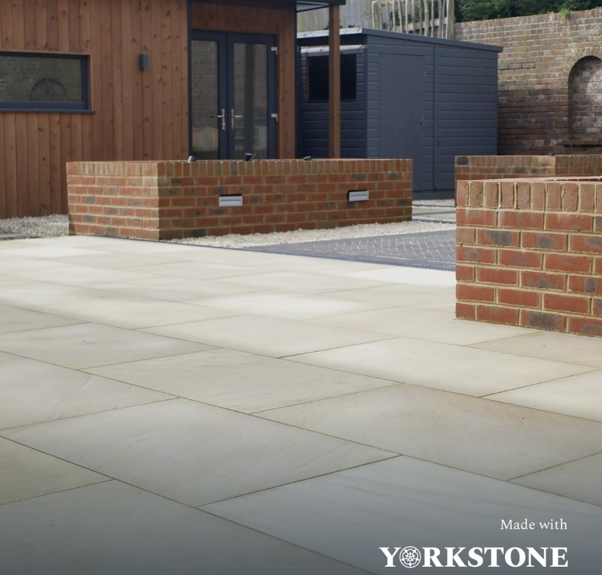 A modern courtyard patio laid in Hebden Sawn Paving by Henry Agg Design